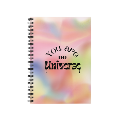 Notebook with 'You are the Universe' text on a colorful abstract background